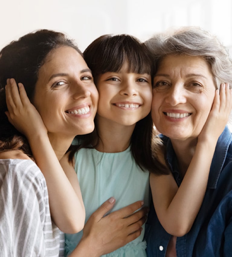 Three woman of different ages at the dentist's office, preparing for their dental appointment.