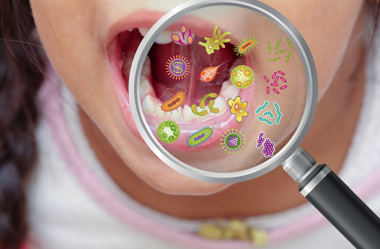 A close-up of a magnified view showing bacteria over a child’s open mouth, highlighting oral health concerns.