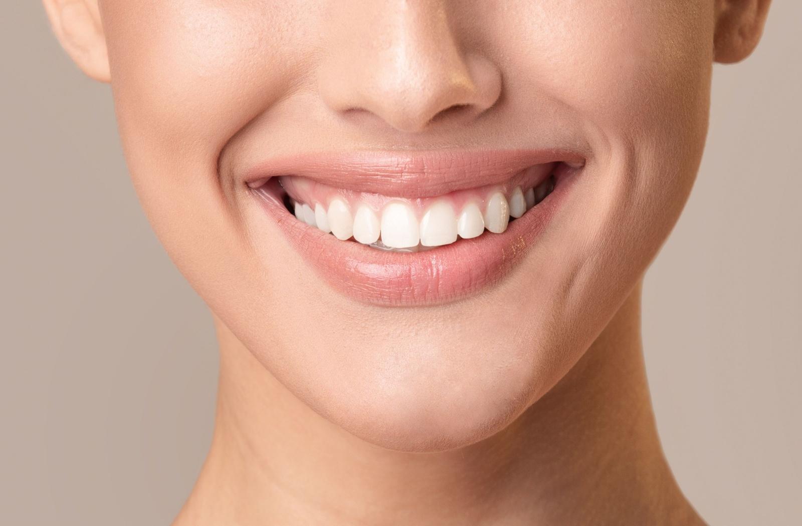 Close-up of a person smiling with bright teeth, highlighting enamel-safe teeth whitening results.